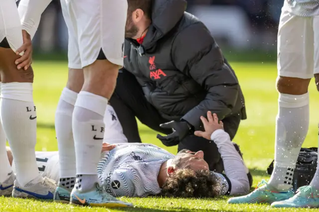 Mohamed Salah receiving treatment during the game.