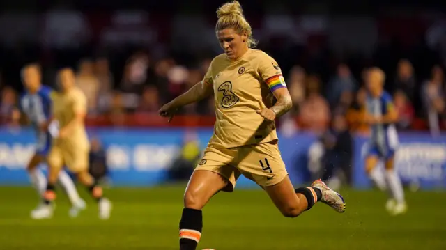 Millie Bright with the ball.