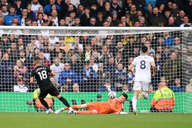 Leeds' goalkeeper Illan Meslier saves a shot from Andreas Pereira