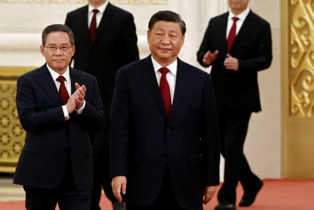 Li Qiang walks out just behind Xi