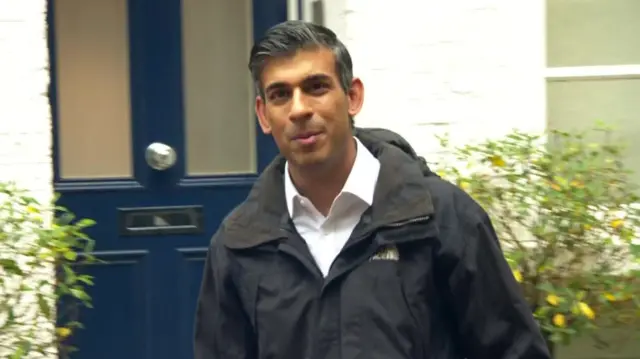 Rishi Sunak outside his home on Sunday morning