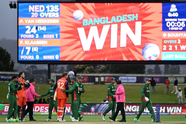 Bangladesh players shaking hands with their Netherlands counterparts after sealing victory