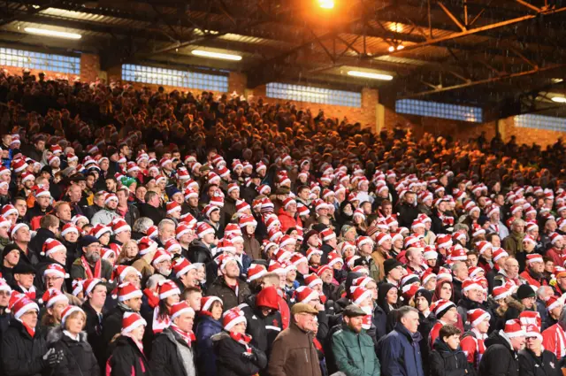 Premier League fans with Santa hats