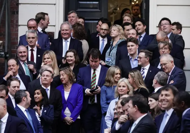 Tory MPs waiting outside Conservative Party HQ