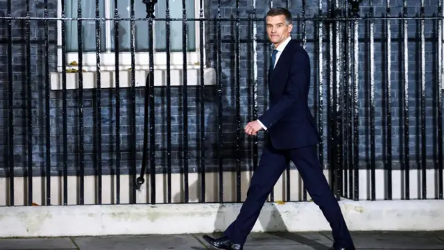 Mark Harper walks outside Number 10 Downing Street, in London, Britain, October 25, 2022