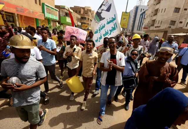 Protesters march during a rally against military rule