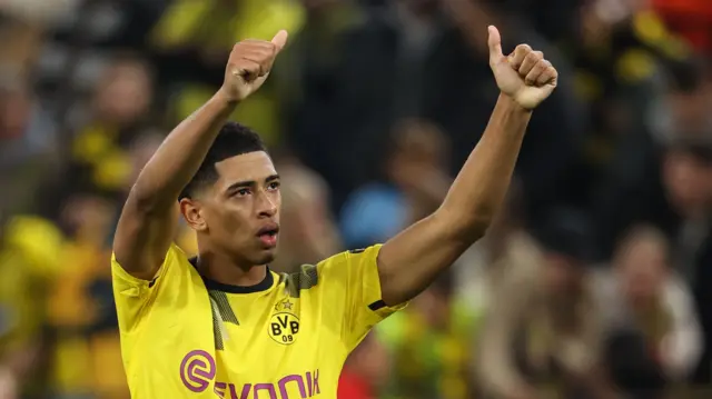 Jude Bellingham acknowledges the Dortmund fans after the goalless draw against Manchester City