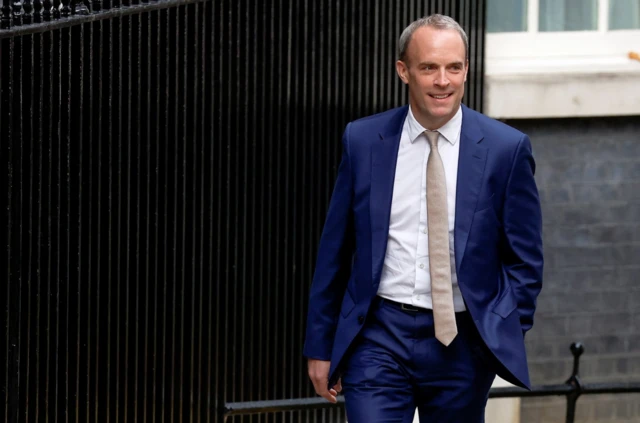 Dominic Raab walks up Downing Street