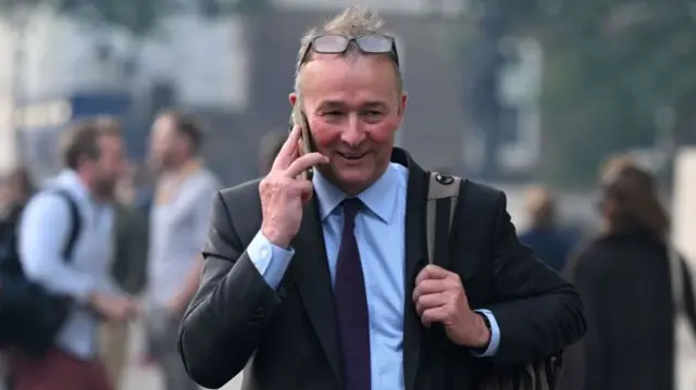 Simon Hart leaves the Cabinet Office on Whitehall in central London