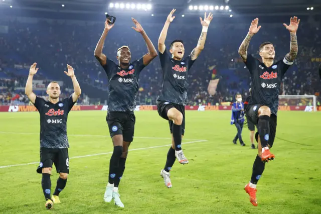 Napoli players celebrate a hard-earned victory at Roma