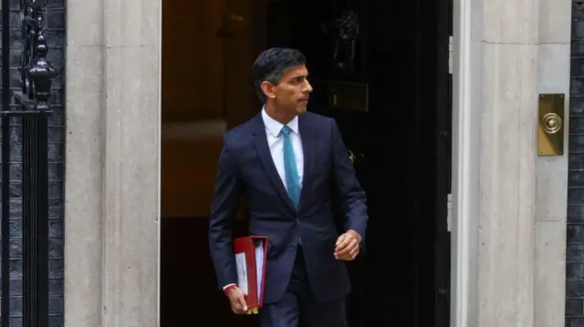 Britain's Prime Minister Rishi Sunak walks outside Number 10 Downing Street, in London, Britain, October 26, 2022.