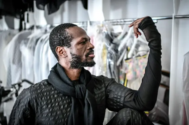 Cameroonian fashion designer Imane Ayissi poses in his atelier in 2021.