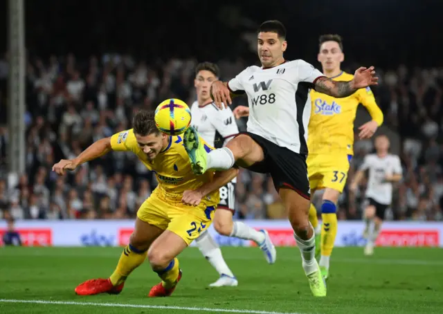 Aleksandar Mitrovic is challenged by James Tarkowski