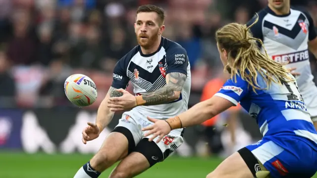 Marc Sneyd passes the ball