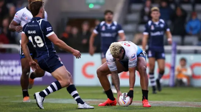 Fiji score a try against Scotland