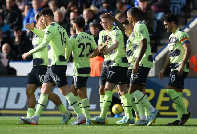 Kevin De Bruyne celebrates with teammates after scoring City's first goal