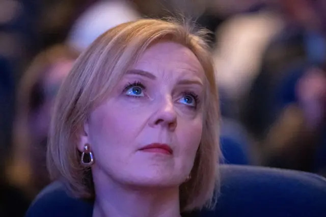 Liz Truss listens to a speaker at this year's Conservative Party conference