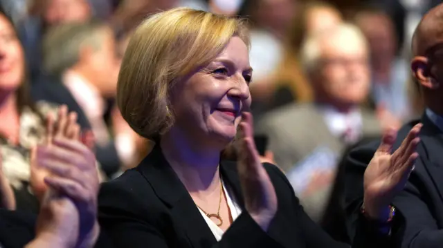 Liz Truss applauds her chancellor, Kwasi Kwarteng, after he delivered his party conference speech