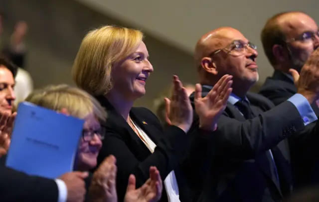 Prime Minister Liz Truss applauding Chancellor of the Exchequer Kwasi Kwarteng