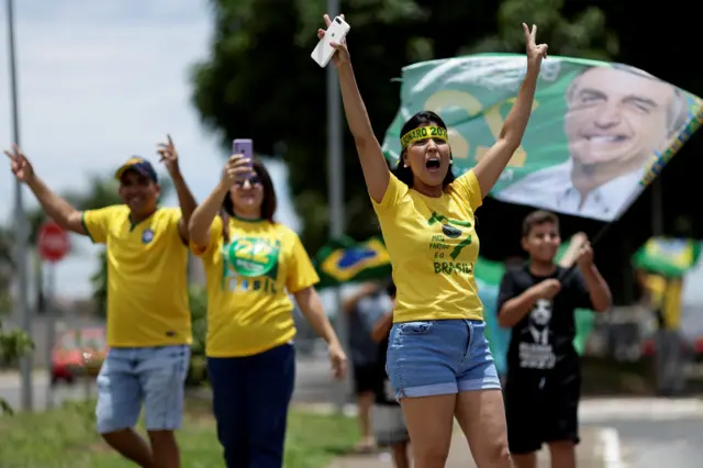 Dressed in the colours of the flag, supporters of current President and candidate Jair Bolsonaro head to the polls in Brasilia