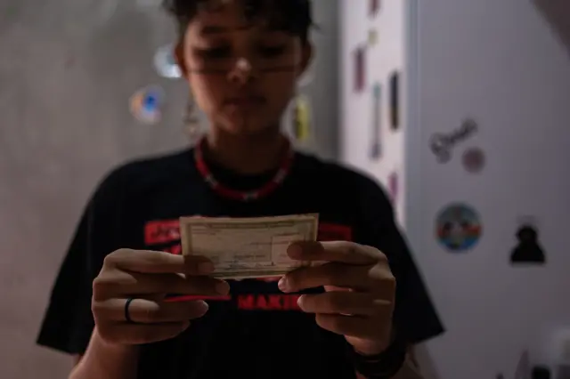 An 18-year-old indigenous student prepares to vote for the first time in Parque das Tribos, in Manaus, Amazon