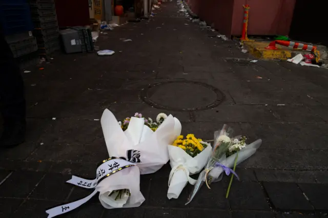 Flowers laid at scene of stampede tragedy