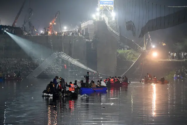 Rescue boats seen at the site of the bridge collapse