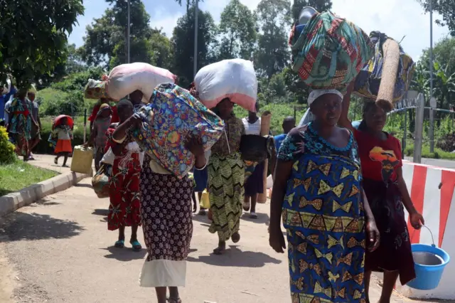 Congolese refugees, fleeing due to fighting between M23 rebels and Democratic Republic of Congo government forces,