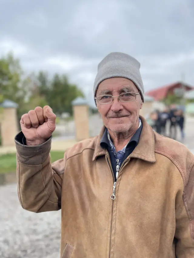 A man holds up his fist in Ukraine