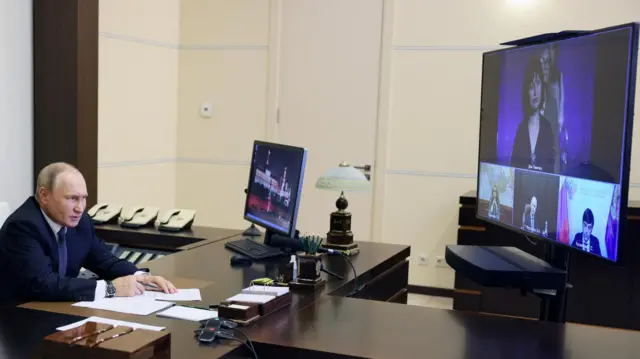 Russian President Vladimir Putin speaking to award-winning teacher on video call