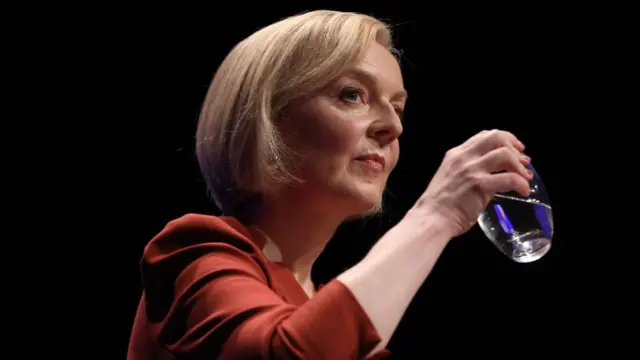 British Prime Minister Liz Truss drinks a glass of water while delivering her keynote speech at the Conservative Party Conference in Birmingham, Britain, 05 October 2022.