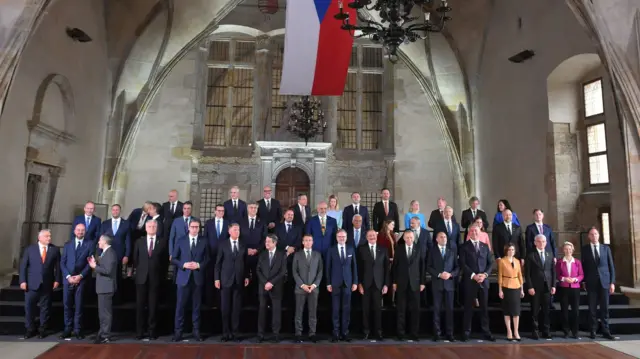 Attendees pose for family photo