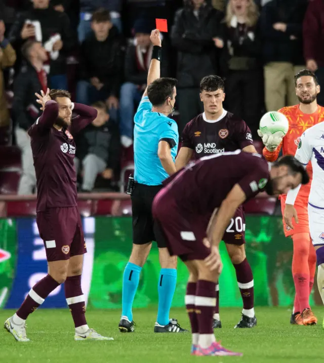 Neilson is sent off as Grant and Kiomourtzoglou watch on