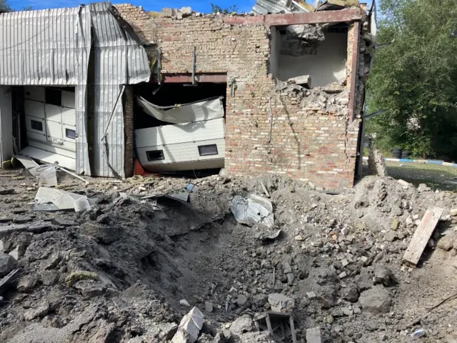 A 10ft-wide (3m) crater following a missile strike in Zaporizhzhia