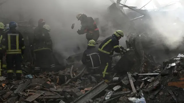 Rescuers work at the site of a residential building heavily damaged by a Russian missile strike, amid their attack on Ukraine, in Zaporizhzhia, Ukraine October 6, 2022.