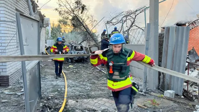 Rescue teams at work at the site of blasts in Zaporizhzhia