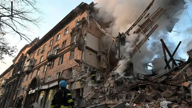 Rescue teams at work at a damaged building in Zaporizhzhia