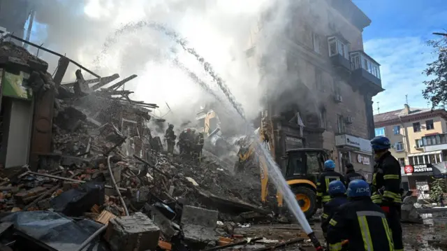 Rescuers work at the site of a residential building heavily damaged by a Russian missile strike, amid their attack on Ukraine, in Zaporizhzhia, Ukraine October 6, 2022