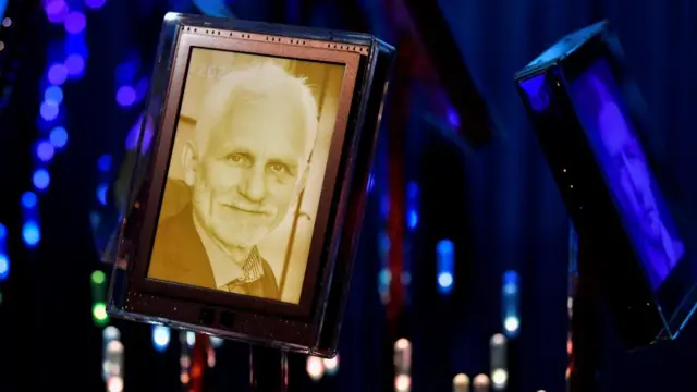 An image showing a framed photo of Ales Bialiatski