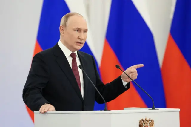 Russian President Vladimir Putin gives a speech