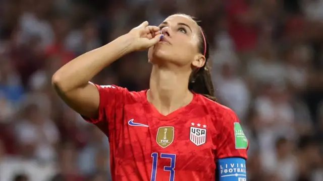 Alex Morgan celebrates goal against England