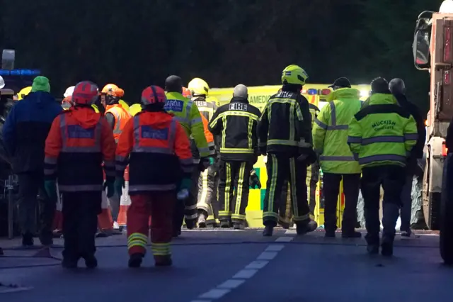 Emergency services staff at the scene of the explosion in Creeslough