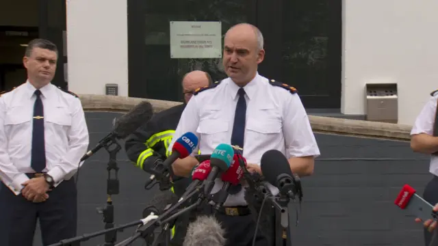 Emergency services representatives speaking at a press conference