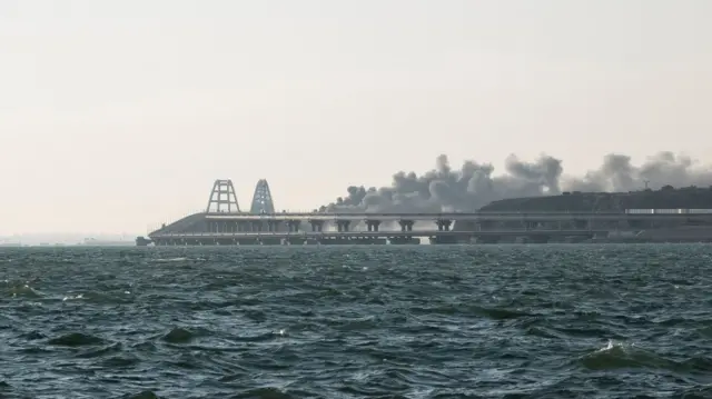 Smoke rises from fire on the Kerch bridge in the Kerch Strait, Crimea