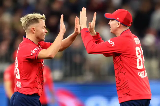 England's Sam Curran and Harry Brook celebrate a wicket v Australia in T20 in Perth