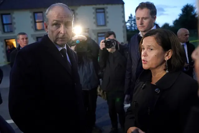 Taoiseach (Irish PM) Micheal Martin with Sinn Féin leader Mary Lou McDonald in Creeslough