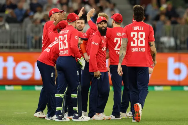 England celebrate a Mark Wood wicket v Australia in Perth