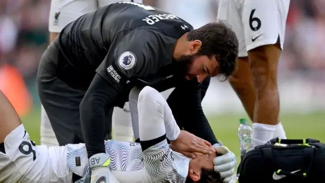 Trent Alexander Arnold is comforted by Alisson Becker