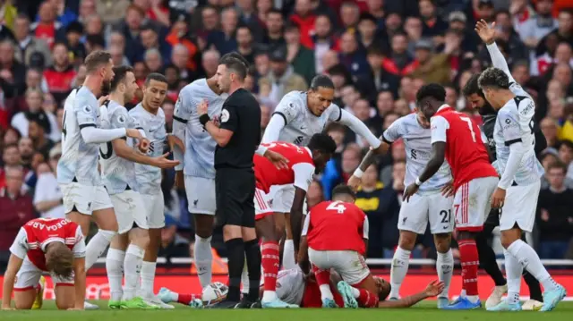 Gabriel Jesus goes down after an elbow to the face.