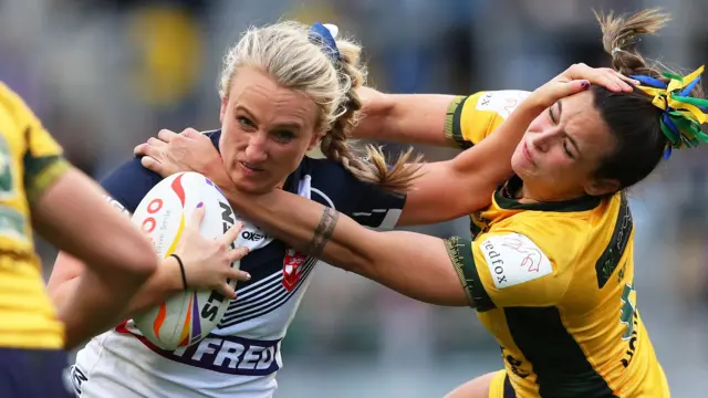 Jodie Cunningham carries the ball for England